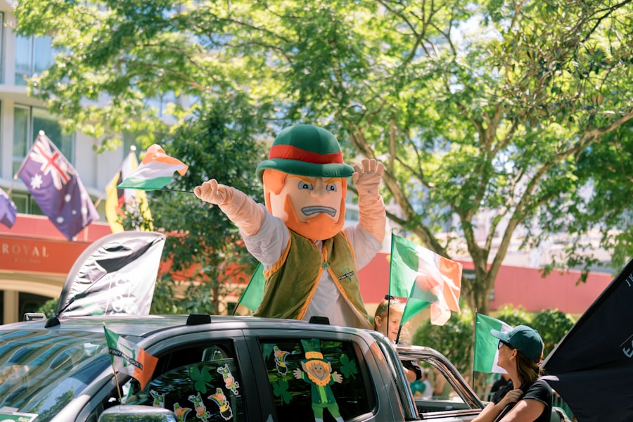 Mascot in a parade with flags and cars
